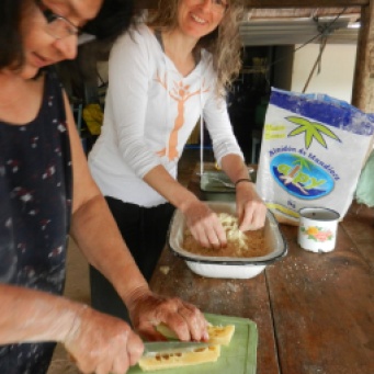Mixing mbeju dough by hand, adding the cheese